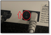 A close up of a power cord

Description automatically generated